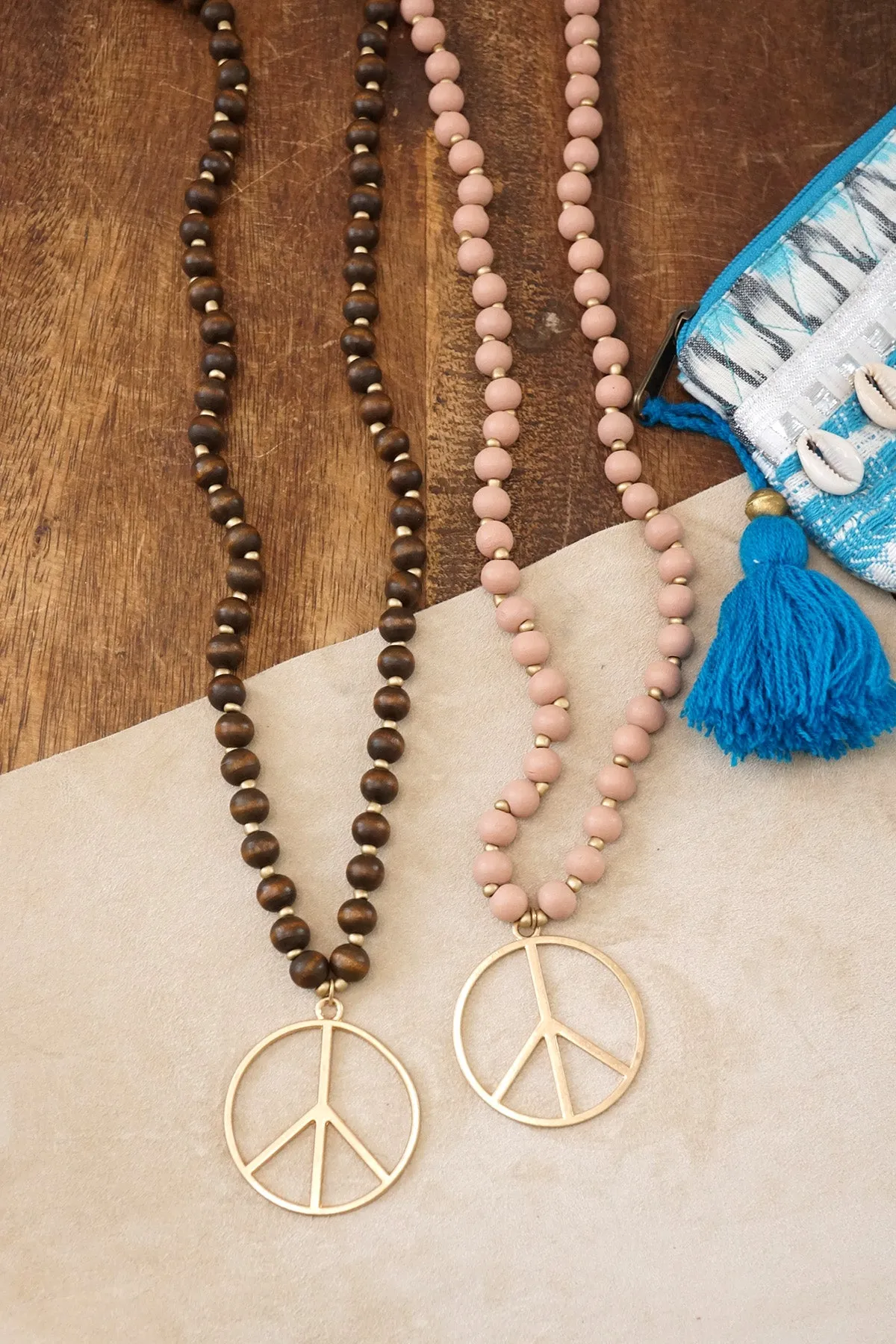 Long Wood Bead Necklace with golden peace sign pendant - Brown