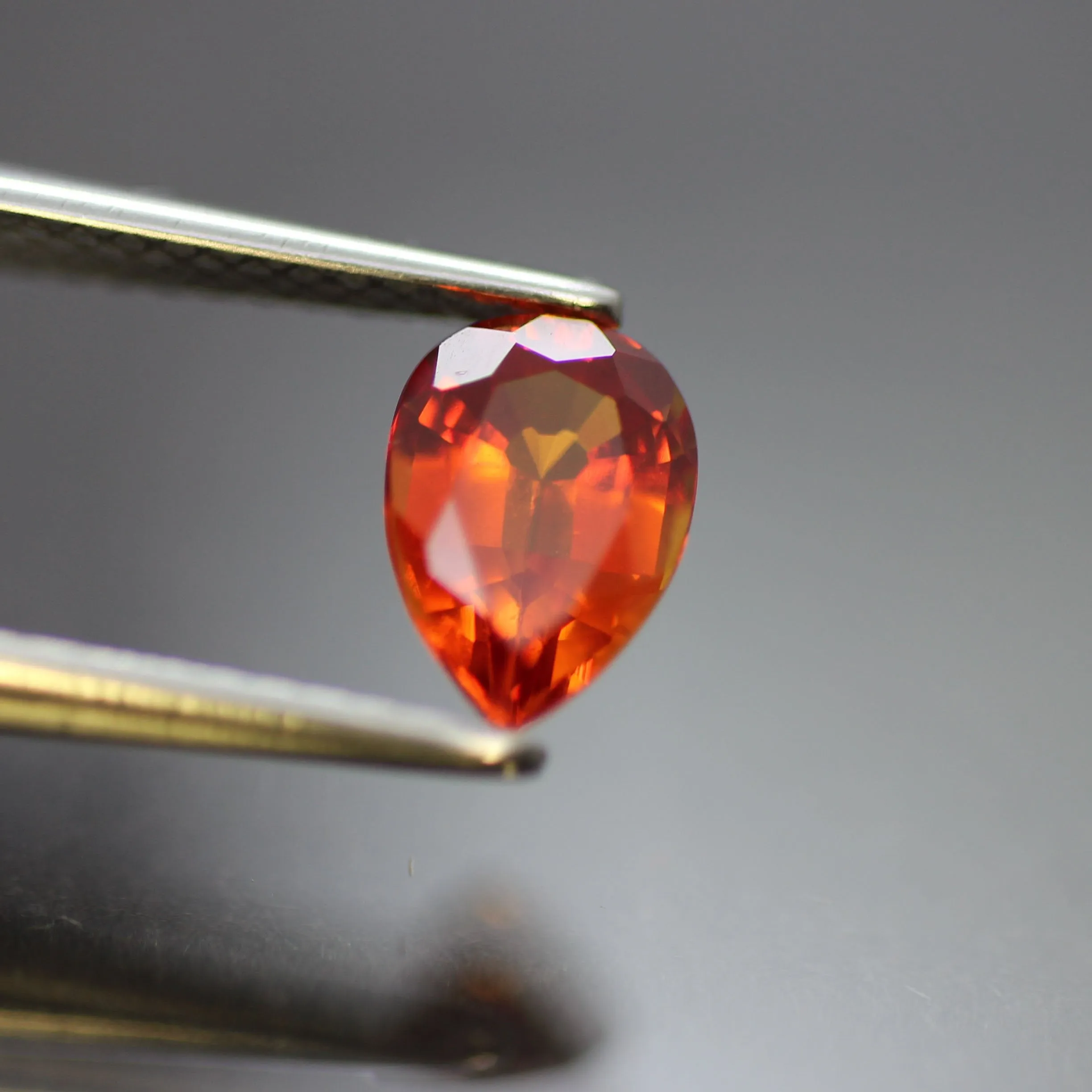 Padparadscha Sapphire | lab created, pear cut 7 x 5mm, VS 0.7ct