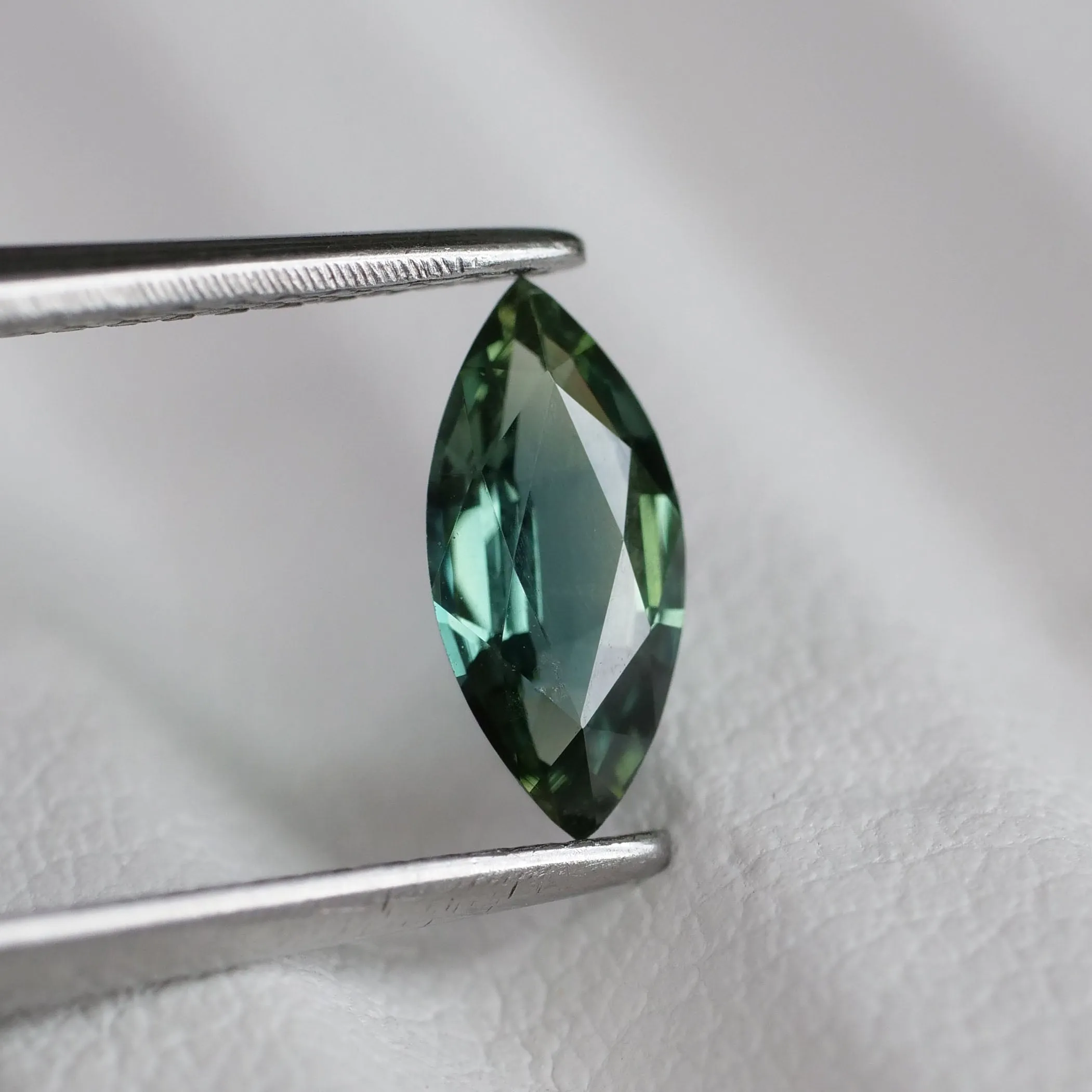 Sapphire teal | natural, greenish blue color, marquise cut 8x4 mm, 0.56 ct, Australia